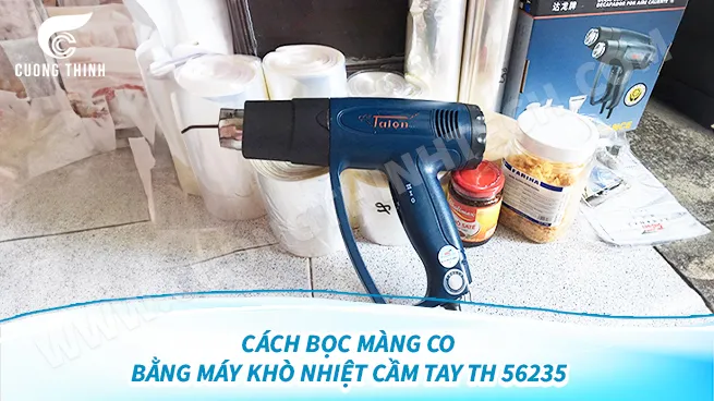 alt: Cách bọc màng co bằng súng khò nhiệt cầm tay TH 56235