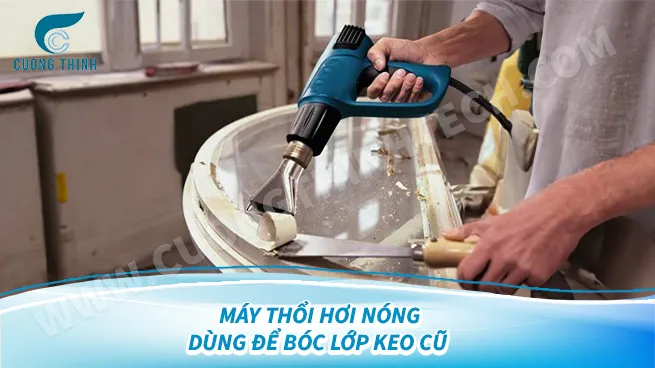 alt:  Súng khò nhiệt dùng để bóc lớp keo cũ